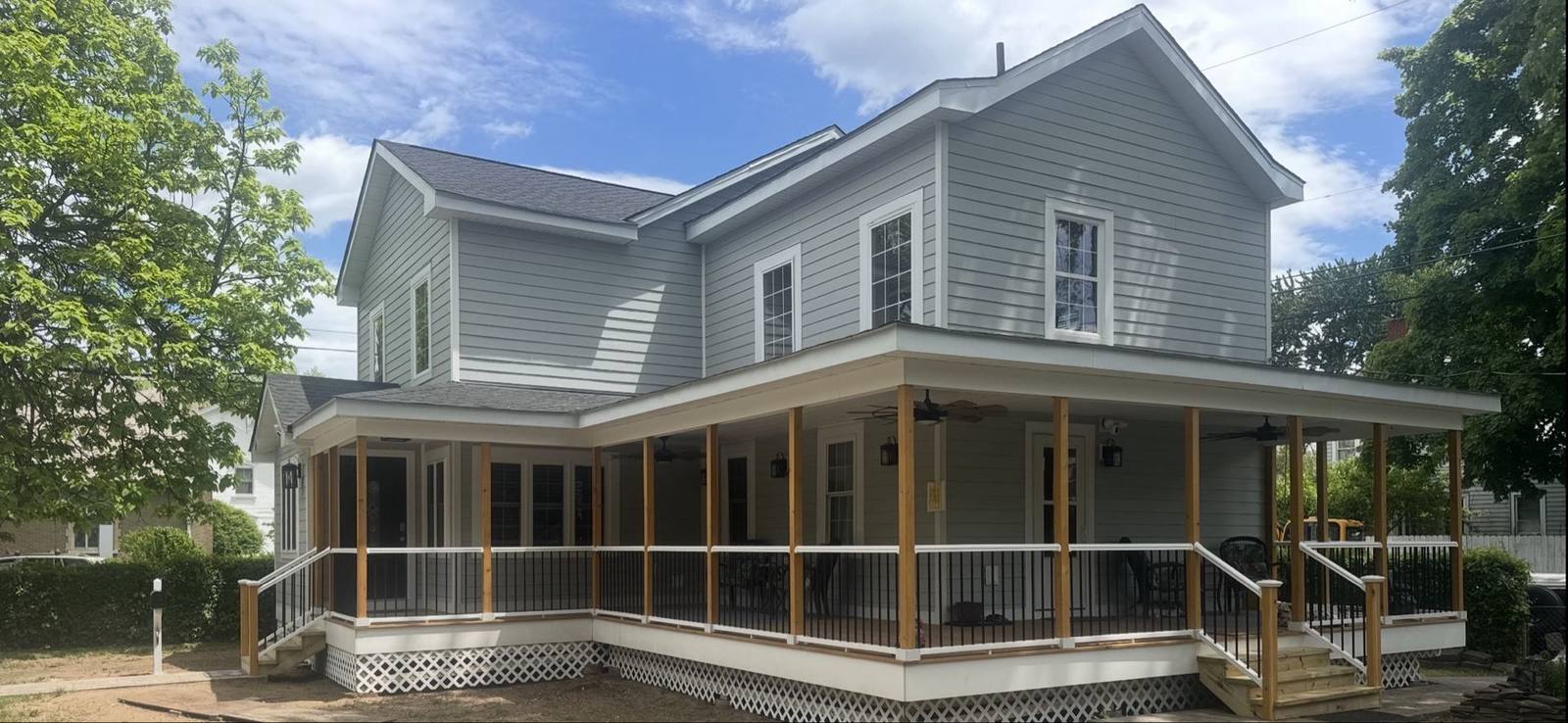 Finished home renovation by Wilson's Custom Construction featuring a new wraparound porch